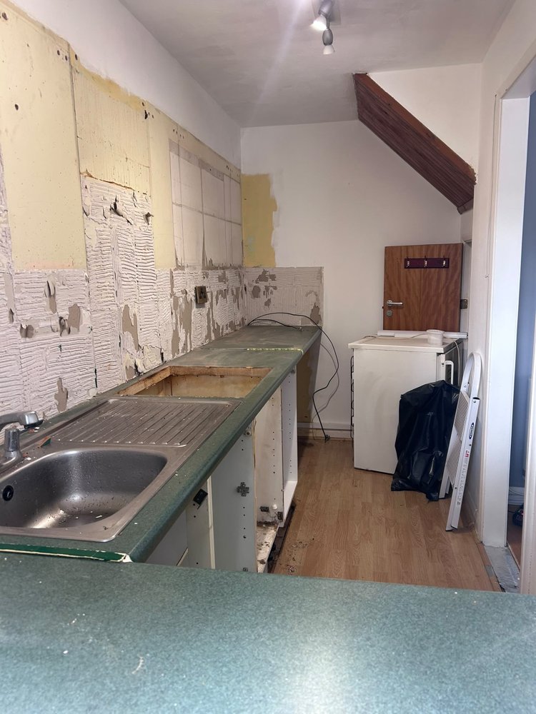 The kitchen stripped back to bare walls ready for plastering